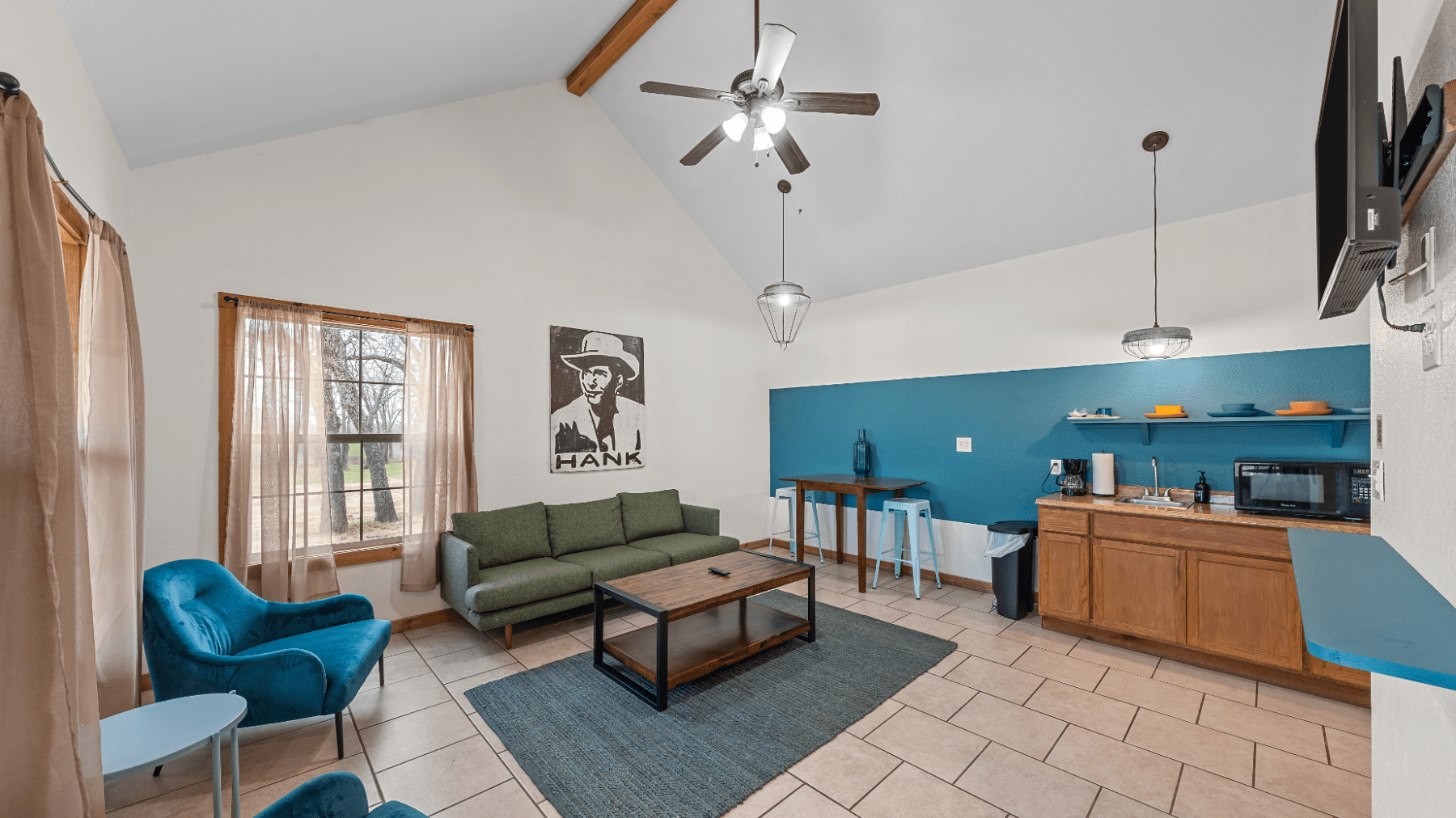 a living room filled with furniture and a tv